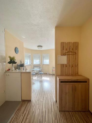 an empty room with a kitchen and a dining room at 1 Raumwohnung für 2 Gäste in Wehr