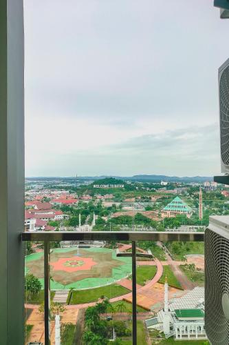 a view of a baseball field from a window at Palam Mansion at Apartment One Residence in Batam Center