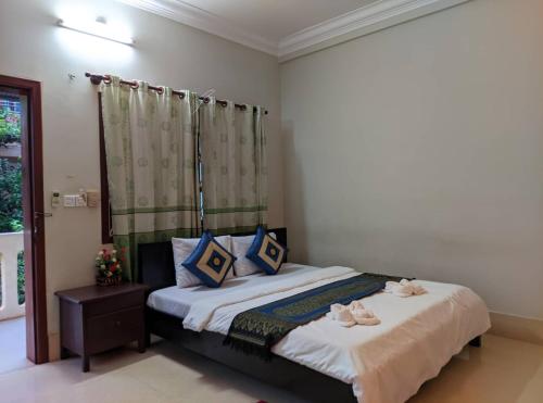 Postel nebo postele na pokoji v ubytování IKI IKI Guesthouse