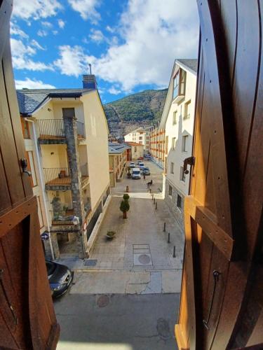 a view from a window of a street with buildings at En el pleno centro de Biescas con garaje, ascensor y WiFi in Biescas