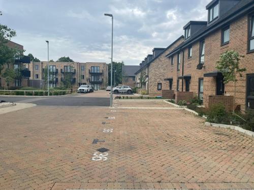 an empty parking lot in a city with buildings at Rendezvous in Romford