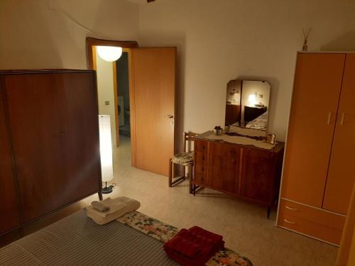 a bathroom with a vanity and a mirror and a sink at Casa vacanza Colle Renazzo con terrazzo in collina 15 min. dal mare in Mafalda
