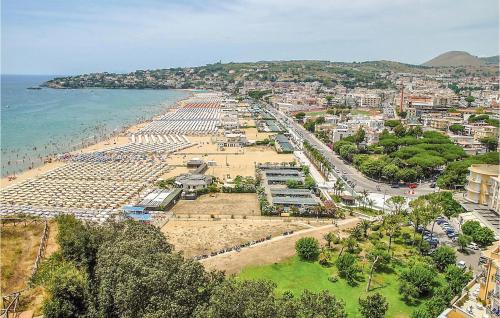 a view of a beach with a city and the ocean at Nice Home In Gaeta With Kitchen in Gaeta