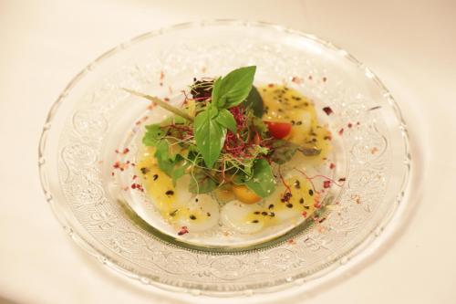 a plate of food on a white table at Hotel-Restaurant Le Mont Paisible, Crans-Montana in Crans-Montana