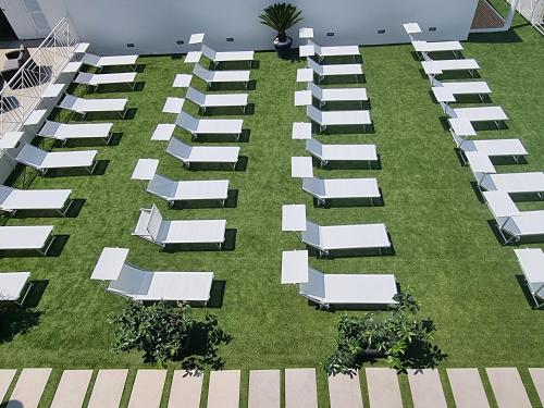 an overhead view of a lawn with lounge chairs at Ranch Palace Hotel in Naples