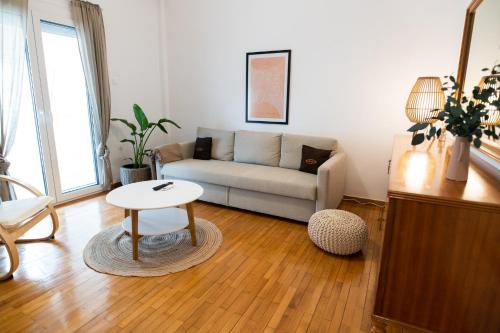 a living room with a couch and a table at Flat 126 in Alexandroupoli