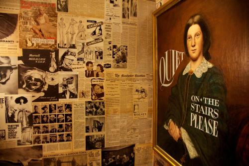 a wall with a picture of a painting of a woman at The Zetter Clerkenwell in London