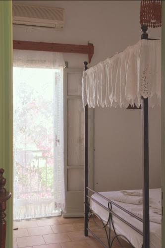 Ένα ή περισσότερα κρεβάτια σε δωμάτιο στο Patmos Villas