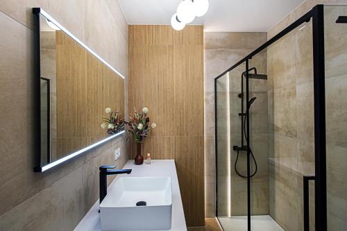 a bathroom with a sink and a shower at Hillside7 Micro-Apartment 16 in Bielsko-Biała