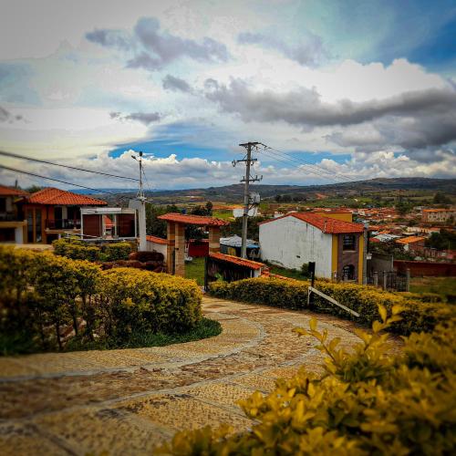 a town with a dirt road in a city at Hotel Las Rocas Resort Villanueva in Villanueva