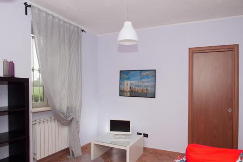 TV a/nebo společenská místnost v ubytování B&B La Pellizzera