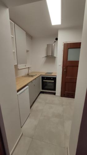 Kuchyň nebo kuchyňský kout v ubytování Pokoje 2-osobowe z prywatną łazienką i kuchnią