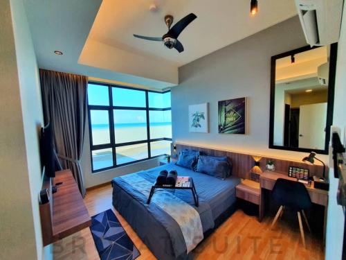 a bedroom with a large bed and a large mirror at Brojat Suite Family Sea View @ Imperium Residence in Kuantan