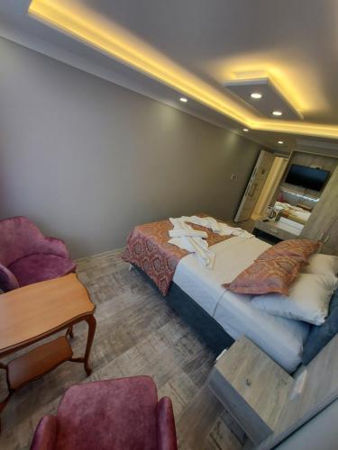 Ένα ή περισσότερα κρεβάτια σε δωμάτιο στο VERSECA HOTEL