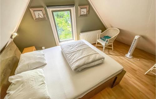 Nice Home In Wierum With Kitchenにあるベッド