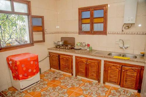 a kitchen with a sink and a counter top at Ali Baba complete Apartment Hostel 8Person in Chefchaouen