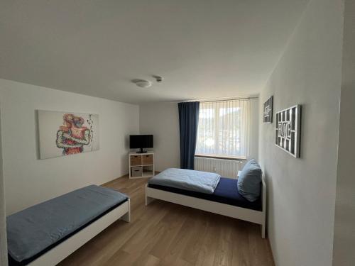 Ένα ή περισσότερα κρεβάτια σε δωμάτιο στο Ferienwohnung Bergstraße