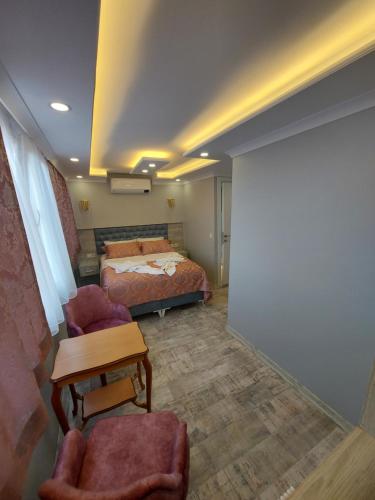 Ένα ή περισσότερα κρεβάτια σε δωμάτιο στο VERSECA HOTEL