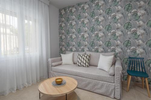 a living room with a couch and a table at Apartment Patricia in Zakynthos Town