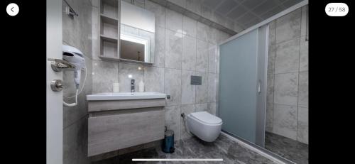 a bathroom with a sink and a toilet at Villa Sunrise in Dalyan