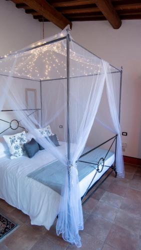 Postel nebo postele na pokoji v ubytování I Salici Agriturismo