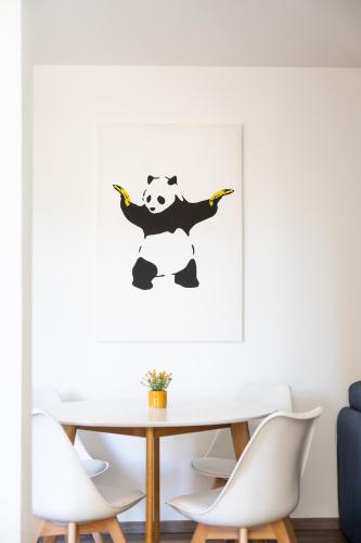 a dining room with a table with a panda bear on it at Apartments am Neuen Theater - Altstadt - Zentral - Küche - Wifi - Powered by Ko-Living in Halle an der Saale