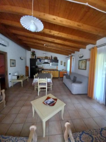 a living room with a couch and a table at Villa Veronica in Sedini
