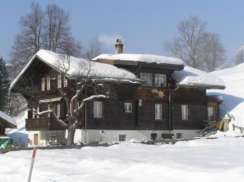 a large wooden house covered in snow at Locherboden in Grindelwald