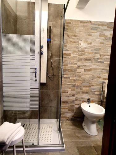 a bathroom with a shower and a sink at Alla Posta Guest House in Garna dʼAlpago
