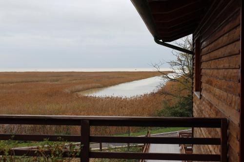 a view of a river from a house at Hotel Caneo in Fossalòn