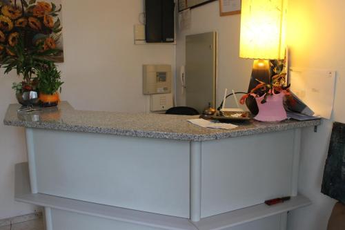 a counter top in a kitchen with a desk at Alojamento Local Santa Cruz in Miranda do Douro