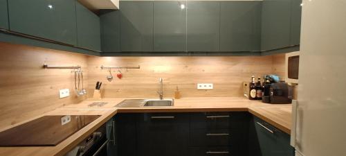 a kitchen with a sink and a counter top at Le Flory'lège in Saint-Gervais-les-Bains