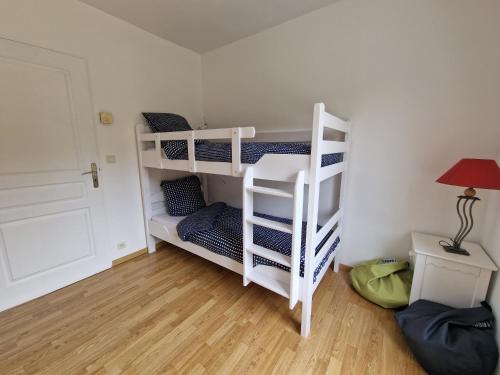 Cama o camas de una habitación en Gîte de Kerninon Maison spacieuse et lumineuse