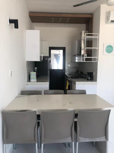 a kitchen with a large table and chairs at NUEVO Depto vista al mar. in Boca del Río