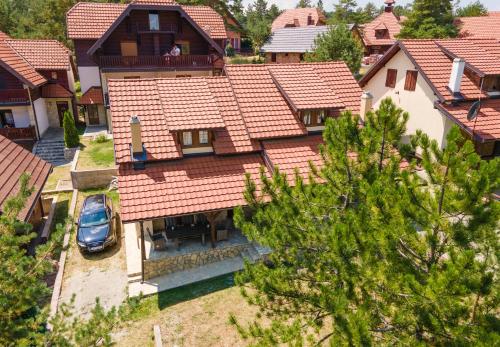 an overhead view of a house with a car parked in front at Vikendica ''CASA DE TARA'' - Planina Tara in Kaludjerske Bare
