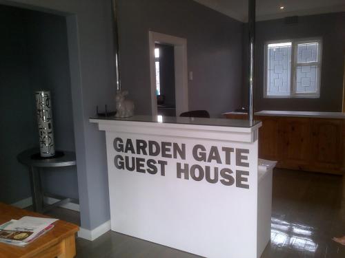 a sign that reads garden gate guest house at Garden Gate Guest House in Port Elizabeth