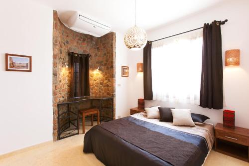 מיטה או מיטות בחדר ב-Red Rock Apartments