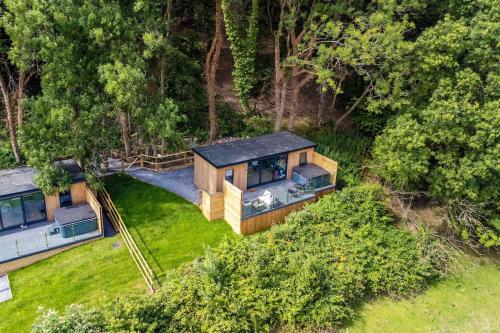 an aerial view of a house in the woods at The Rhossili bay secret in Swansea