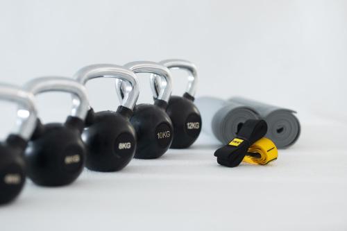 a row of locks with a dumbbell in front at Yposkafon Concept Villa in Megalochori