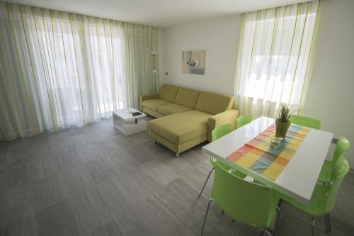 a living room with a couch and a table at Villa Danex Premium in Umag