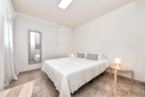 Posteľ alebo postele v izbe v ubytovaní New Cute Apartment at Salinetas Beach.
