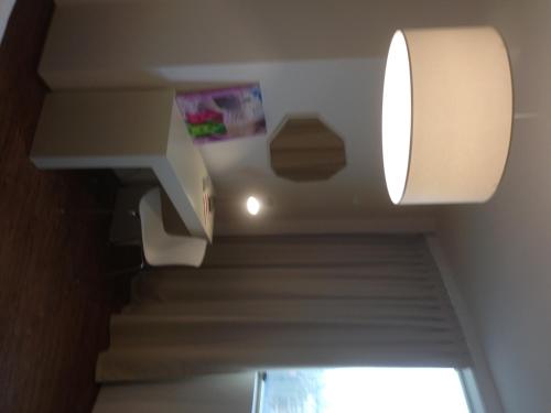 a staircase in a house with a light on the ceiling at Hotel Piero Della Francesca in Arezzo