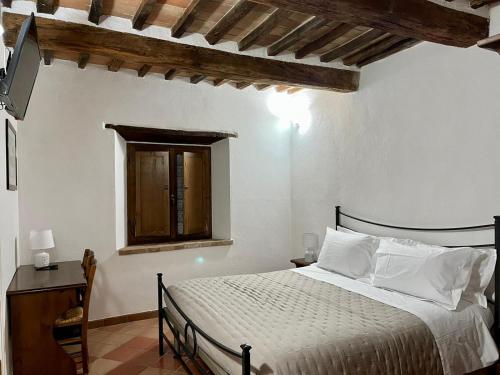 Postel nebo postele na pokoji v ubytování Agriturismo Le Querciole in Val d'Orcia