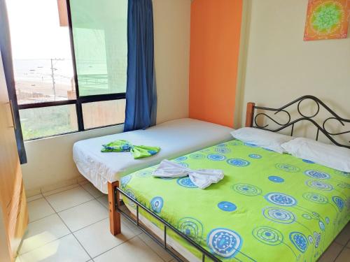Ein Bett oder Betten in einem Zimmer der Unterkunft Suites Marbensa, Malecón de Atacames