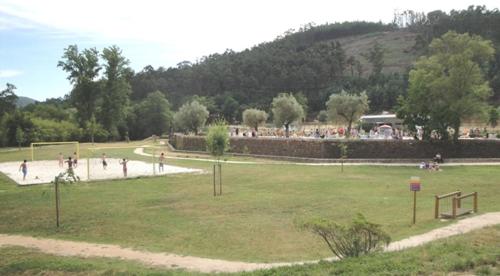 a group of people walking around a park at Casa dos Copos - Drinks House in Miranda do Corvo
