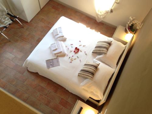 Cama o camas de una habitación en L'Isolo b&b e case vacanza