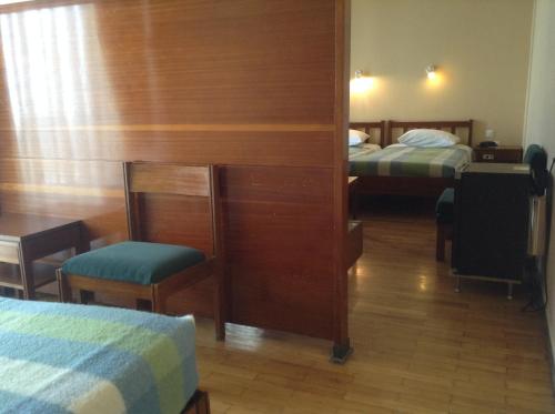 Кровать или кровати в номере Hotel Alexandros
