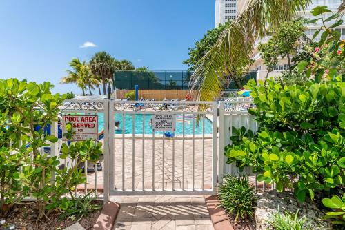 a gate leading to a pool with a pool area at Ocean Beach Condo 3BR On the Sand 811 in Fort Lauderdale