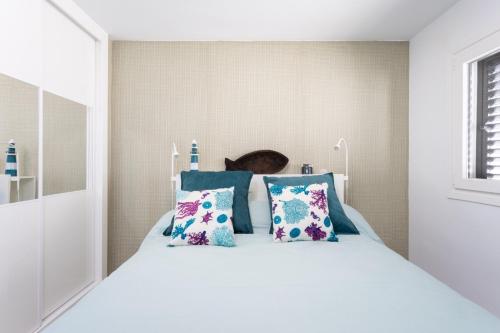 Postel nebo postele na pokoji v ubytování La Fula Beach Rooms