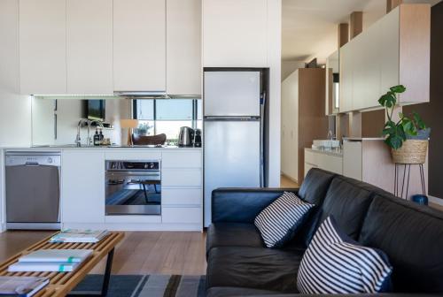 Η κουζίνα ή μικρή κουζίνα στο Aquabelle Apartments